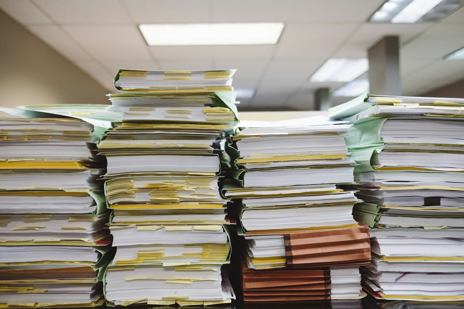 A daunting amount of disorganized paperwork in an office.